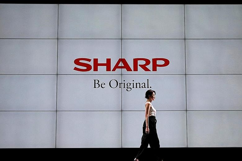 Sharp has said a shift from conventional LCD screens to more flexible Oled screens has been slower than expected due to high prices, making it cautious about near-term aggressive Oled capacity expansion.