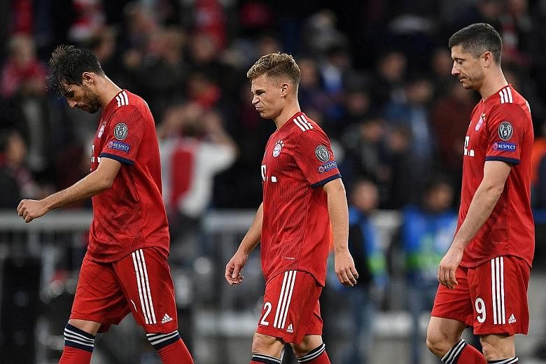 From left: Bayern Munich's Javi Martinez, Joshua Kimmich and Robert Lewandowski looking dejected after the 1-1 Champions League draw with Ajax. Bayern coach Niko Kovac believes his team paid the price for poor passing.