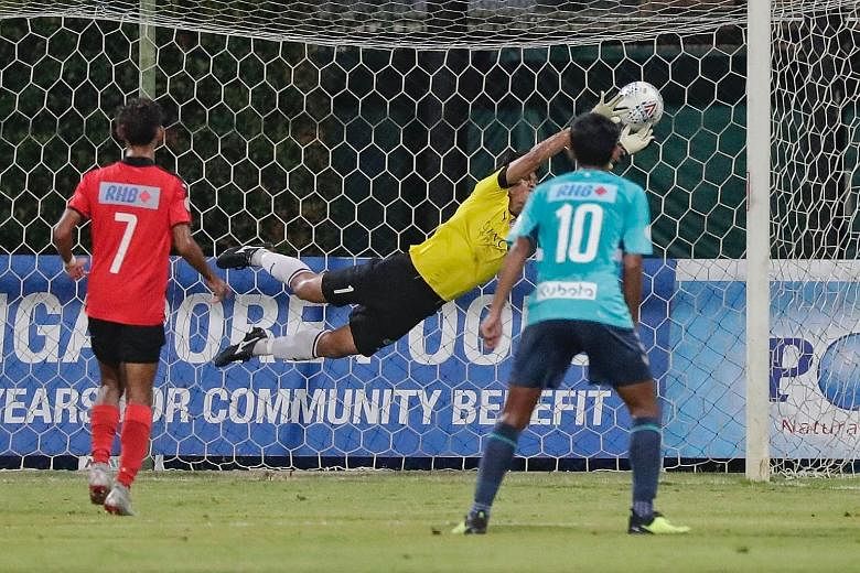 A free kick from Kenya Takahashi (not in picture) slipping through the fingers of Home United goalkeeper Kenji Rusydi during the second leg of the RHB Singapore Cup semi-final at Bishan Stadium yesterday. The goal gave Singapore Premier League champi