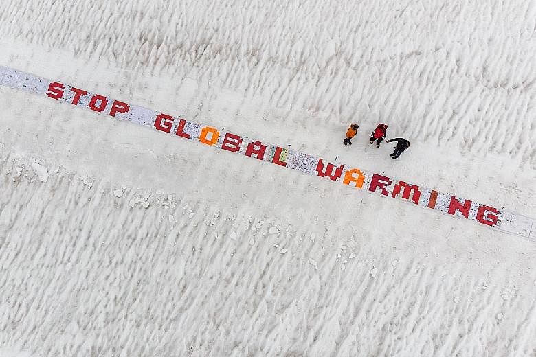 Over 2,500 postcards placed on the Aletsch Glacier in the Swiss Alps on Aug 13, in a test run for a world record attempt to create the largest postcard made up of at least 100,000 standard-sized postcards.