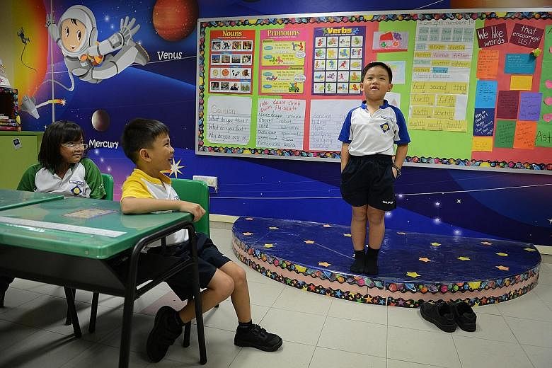 Above: Seng Kang Primary School has performing arts as its niche programme and has a stage in every classroom as a teaching aid. Left: Mr Wong Siew Hoong, director-general of education at the Ministry of Education), says part of its work is finding i