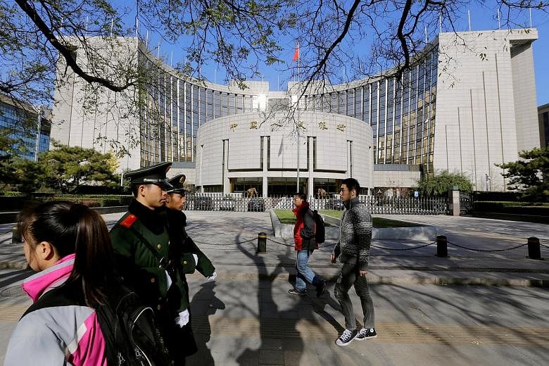 The People's Bank of China headquarters in Beijing. The central bank will inject a net 750 billion yuan (S$151 billion) in cash into the banking system with the cut in reserve requirement ratios.