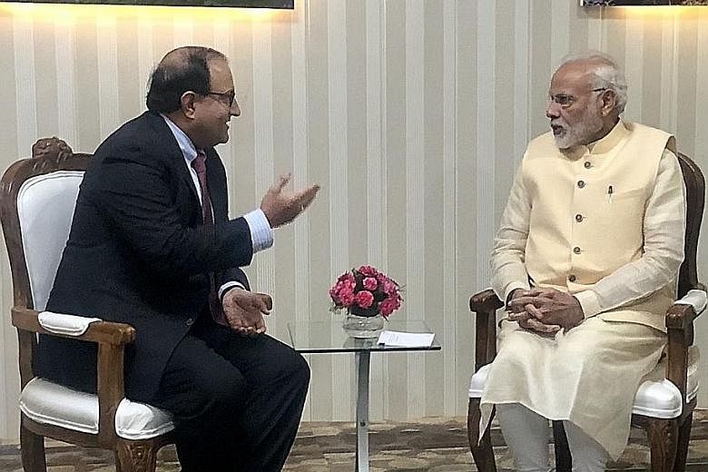 Singapore's Minister-in-charge of Trade Relations S. Iswaran meeting India's Prime Minister Narendra Modi yesterday in Dehradun in the Indian state of Uttarakhand.