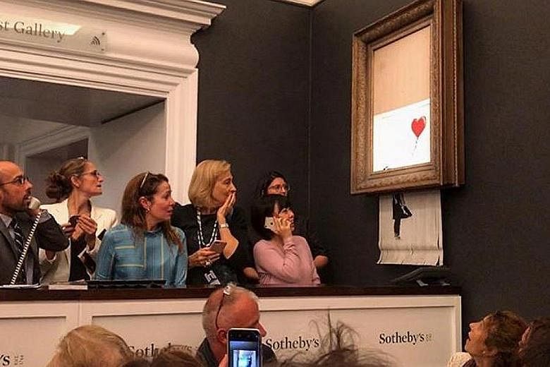 The video of the artwork, Girl With Balloon, being shredded was posted on Banksy's Instagram page last Saturday.