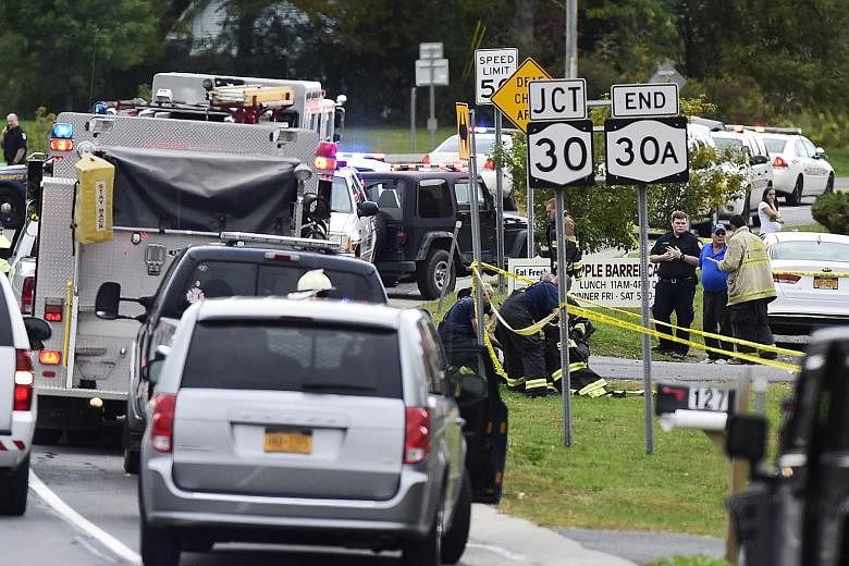 Emergency vehicles at the scene of the two-vehicle collision that left 20 people dead in upstate New York last Saturday.