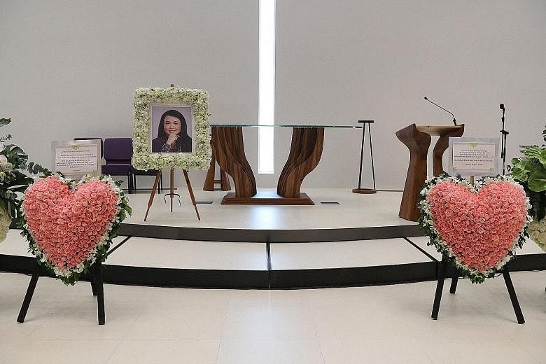 Two heart-shaped wreaths were placed near Dawn Gan's picture by her family at the service yesterday. She died of cancer on Sept 22.