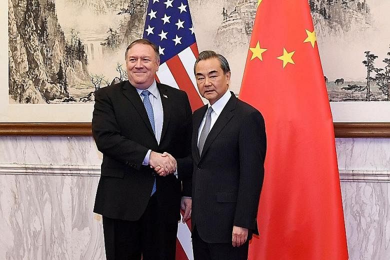 Chinese Foreign Minister Wang Yi with US Secretary of State Mike Pompeo before their meeting at the Diaoyutai State Guesthouse in Beijing yesterday.