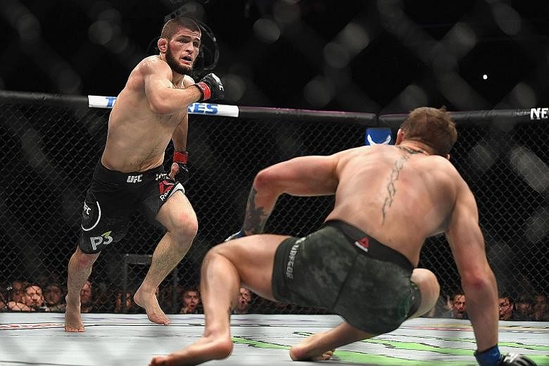 The UFC lightweight championship bout between Khabib Nurmagomedov (left) and Conor McGregor on Saturday night was marred by a post-fight brawl during which the latter was hit from behind by the Russian's sparring partner Zubaira Tukhugov. Featherweig