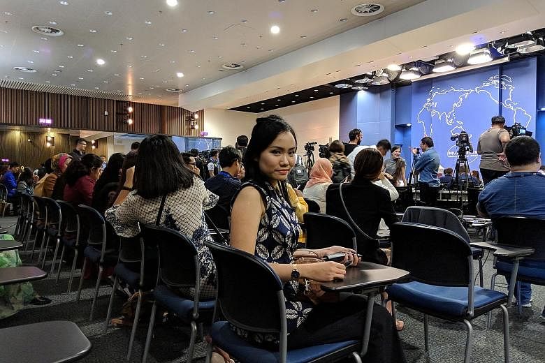 Participants of the Discover China: Asean Youth Camp to China, including Indonesian communications undergraduate Bella Ayu Prasetyo (centre), 22, attending a press briefing by the Chinese Foreign Ministry in Beijing yesterday.