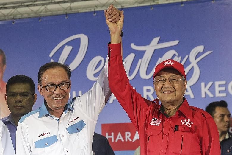 Datuk Seri Anwar Ibrahim and Prime Minister Mahathir Mohamad in a show of unity late on Monday, during a campaign rally ahead of Saturday's by-election in Port Dickson. It was the first time they had campaigned side by side in 20 years.