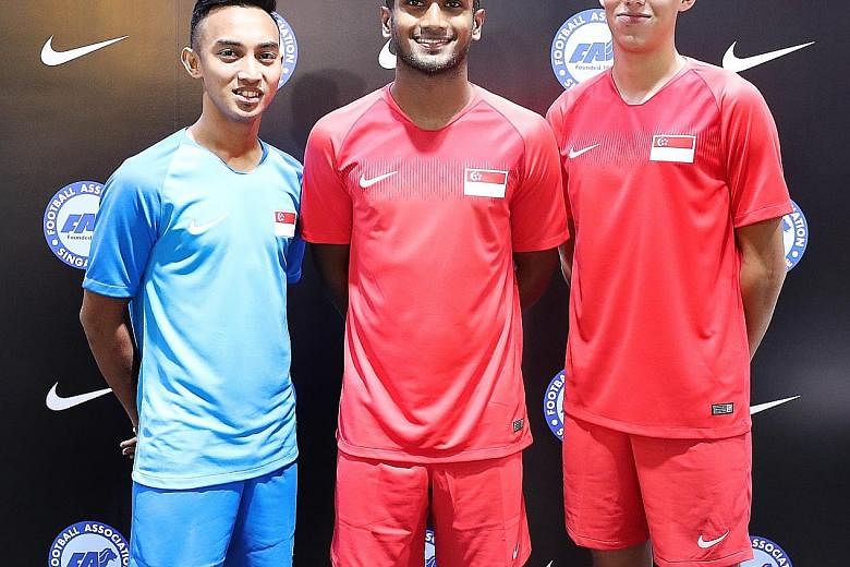 From left: Faris Ramli, new captain Hariss Harun and Jacob Mahler at the launch of the new Lions jersey at Weston Corporation in Kallang Wave Mall yesterday. Singapore will play friendlies against Mongolia and Cambodia on Friday and next Tuesday resp