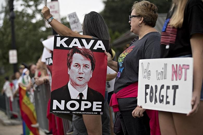 Demonstrators opposed to the appointment of Supreme Court Justice Brett Kavanaugh outside the high court in Washington on Tuesday.