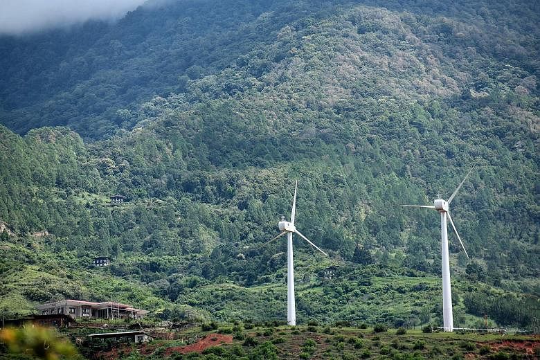 A pair of wind turbines in Rubesa village in Wangdue. They speak of Bhutan's giant stride as the only carbon negative country in the world.