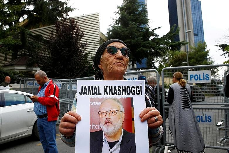 A protester holding a picture of missing Saudi journalist Jamal Khashoggi outside the Saudi consulate in Istanbul on Tuesday.