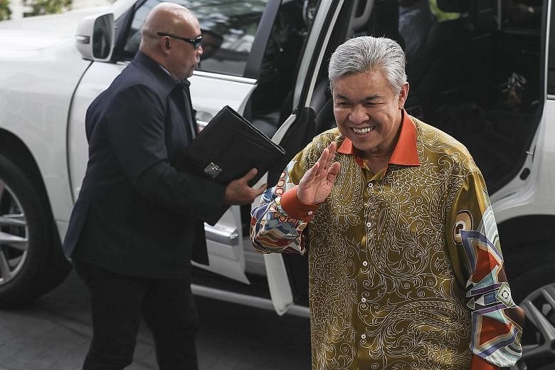 Former deputy prime minister Ahmad Zahid Hamidi arriving yesterday at the Malaysia Anti-Corruption Commission in Putrajaya. Datuk Seri Zahid was interrogated by anti-corruption officers over alleged misappropriation of funds from his family-owned wel