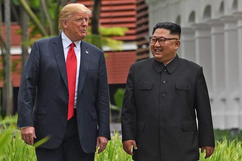 US President Donald Trump with North Korean leader Kim Jong Un during their summit at the Capella hotel in Singapore in June.