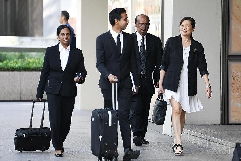 (From right) FMSS' Ms How Weng Fan with her lawyer Leslie Netto and legal team at the Supreme Court yesterday. On day five of a multimillion-dollar civil suit to recover alleged excess payments to FMSS, Mr Netto insisted that AHTC's town councillors 