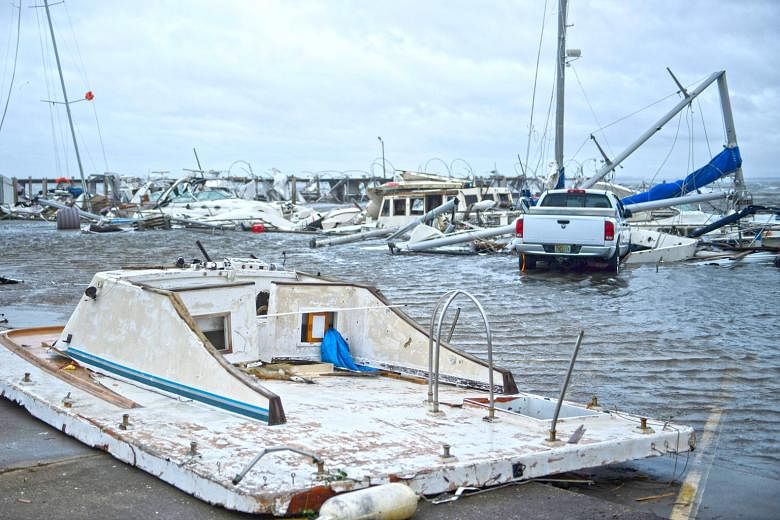 Hurricane Michael left a trail of damaged boats in a marina in Panama City, Florida, after it made landfall on Wednesday. It battered the city for nearly three hours and roads were made virtually impassable.