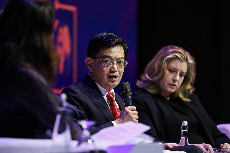 Finance Minister Heng Swee Keat at the IMF-World Bank annual meetings in Nusa Dua, Bali, yesterday. He told reporters the Oxfam report was wrong in its analysis of how Singapore tackled the rich-poor gap.