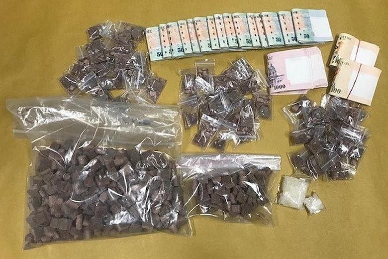 Drugs and cash seized during the Central Narcotics Bureau operation in Teck Whye Lane on Wednesday.