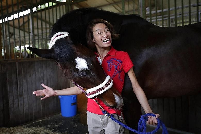 Laurentia Tan, ST Star of the Month, with Dreamer the horse on Thursday.