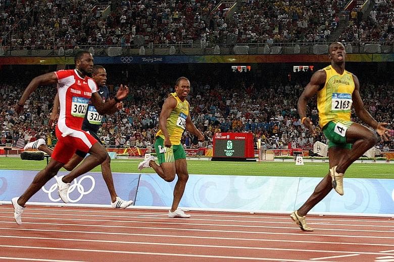 Usain Bolt wins the 100m final with ease at the Beijing Olympics, clocking 9.69sec.