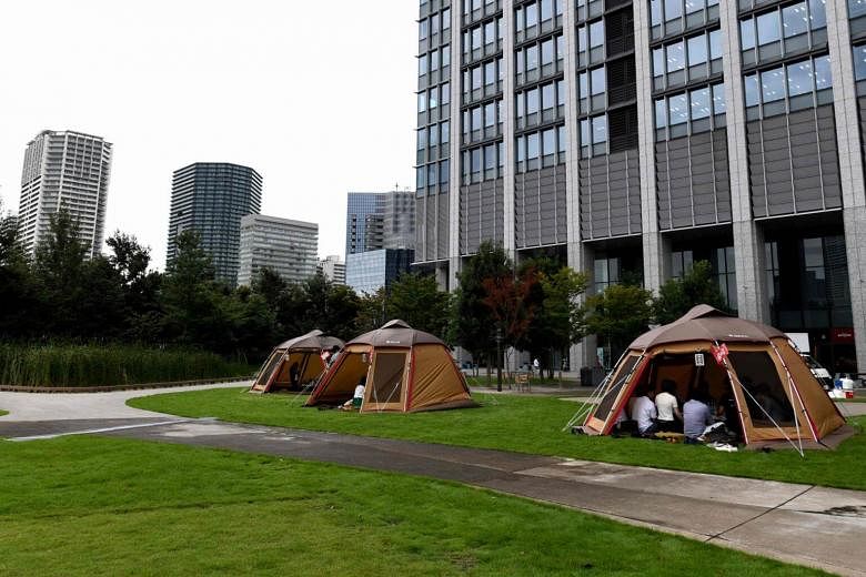 Temporary offices in karaoke rooms, subway stations and outdoor tents -  Japan Inc shifts to unusual workspaces