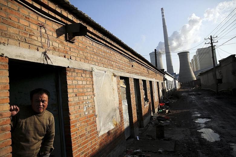 A migrant worker at his accommodation in an area next to a coal-fired power plant in Beijing. Private capital is keen to support the Chinese government's policy priorities to shift economic growth towards a less resource-intensive, more consumer-cent