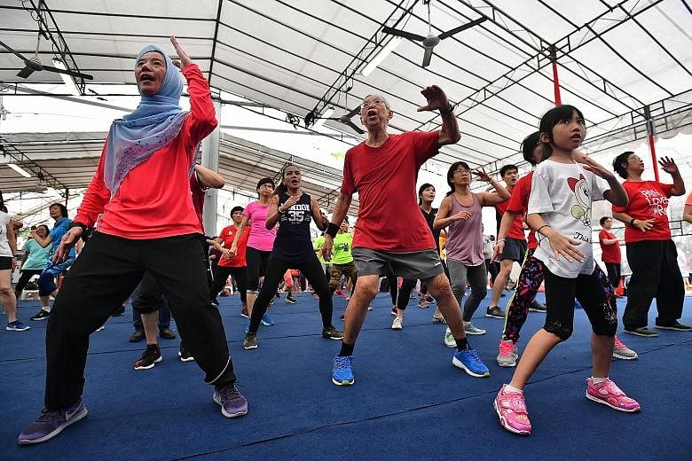 Residents doing a KpopX dance at Toa Payoh Central yesterday, during the launch of the Programme for Active Living, which aims to encourage residents in Bishan-Toa Payoh GRC to develop a lifestyle of regular exercise.