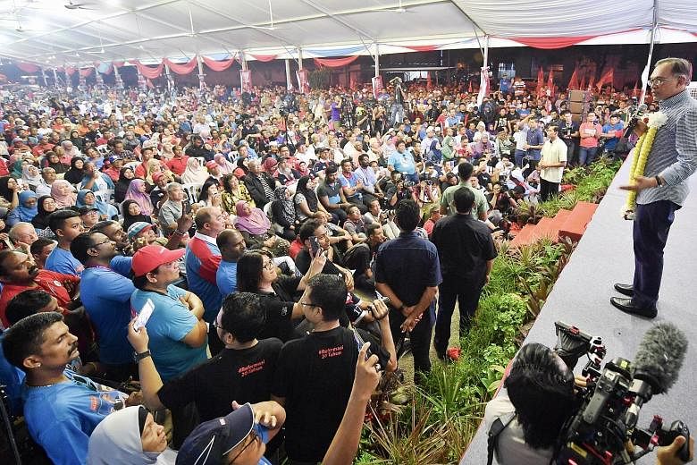 Datuk Seri Anwar Ibrahim thanking supporters on Saturday night after winning the Port Dickson by-election with 72 per cent of the vote. He said the result showed support for the Pakatan Harapan government and its reform agenda.