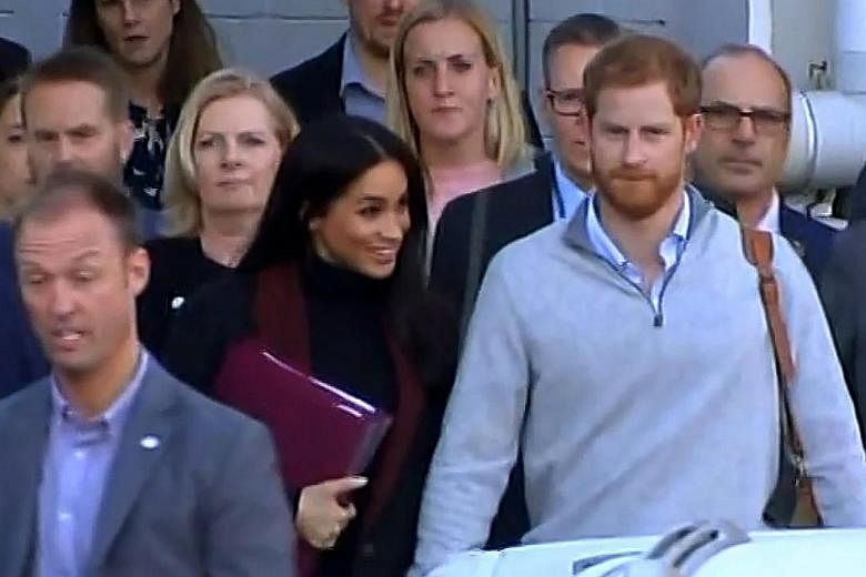 Prince Harry and wife Meghan Markle after landing in Sydney yesterday for their first official royal tour.