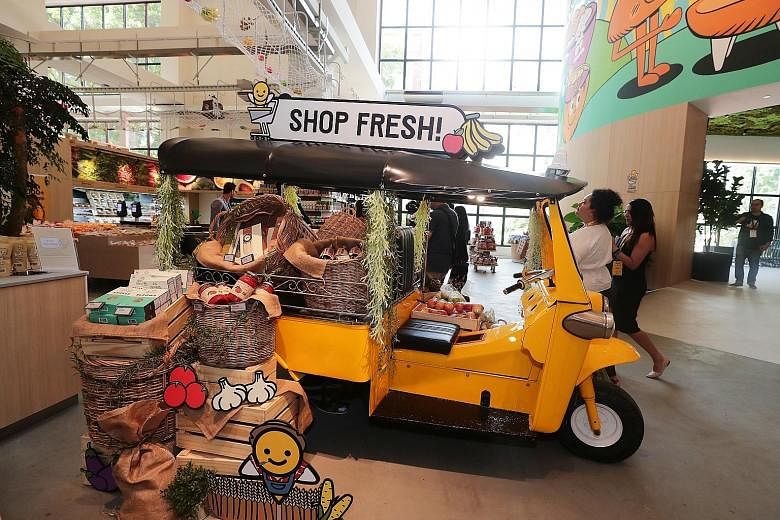 Customers buying 10 or fewer items at the supermarket can use their smartphone to scan each item and pay using the Honestbee app. There will be more than 20,000 products, including fresh produce, seafood and meat on sale when the new Habitat by Hones