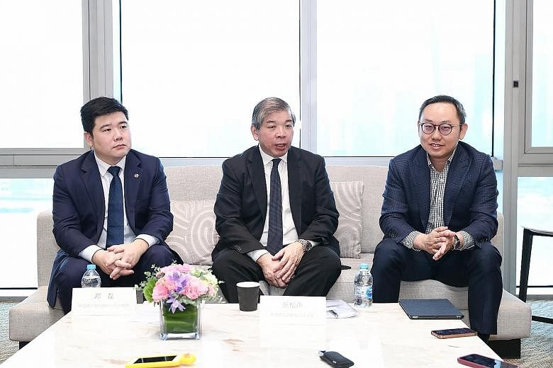 (From left) Mr Deng Lei, assistant general manager of Bank of China Singapore branch; Singapore Business Federation chairman Teo Siong Seng; and Mr Ho Chee Hin, global markets executive director, China group, Enterprise Singapore, at a briefing yeste