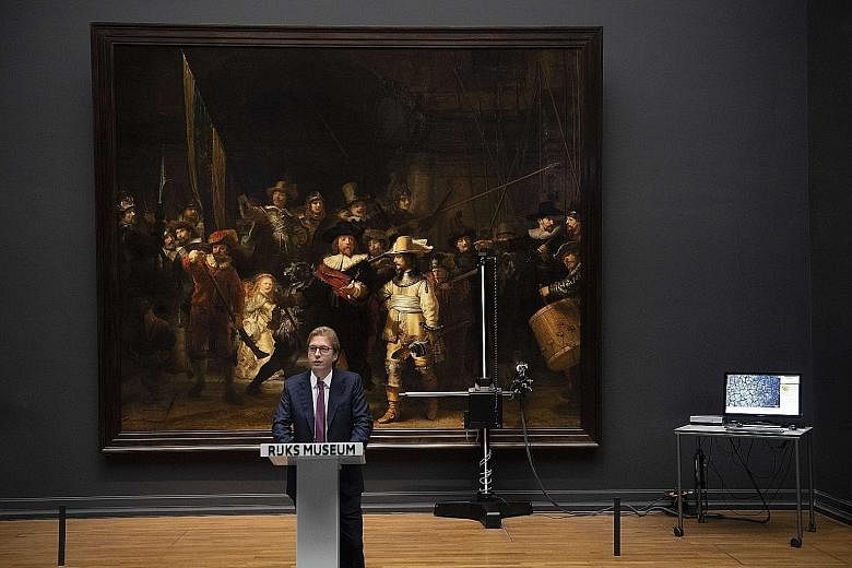 Rijksmuseum general director Taco Dibbits speaking in front of Rembrandt's The Night Watch on Tuesday.
