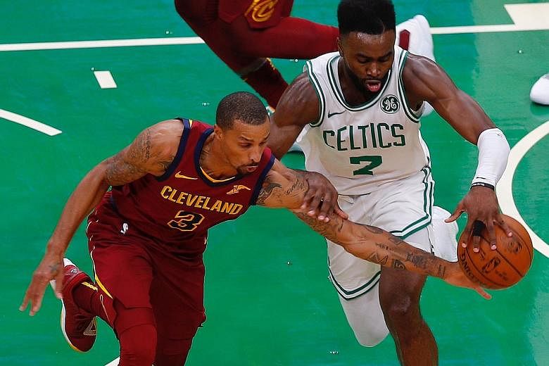 Celtics guard Jaylen Brown and Cavaliers guard George Hill tussling for the ball in their pre-season game on Oct 2. The teams will be vying for supremacy in the Eastern Conference again but Boston have a clear edge after the departure of LeBron James