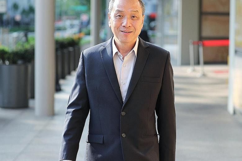 Workers' Party MP Low Thia Khiang at court yesterday, where he took the stand for the first time in the trial to recover alleged improper payments made by AHTC.
