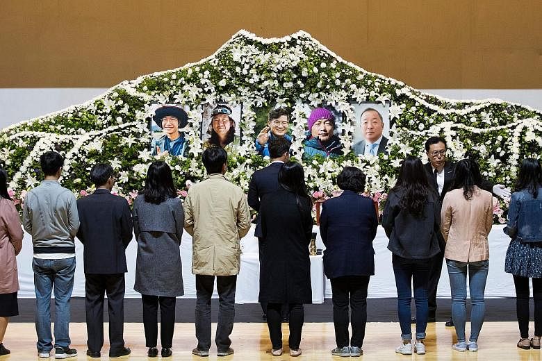 Mourners pay their respects to the five South Korean climbers led by renowned mountaineer Kim Chang-ho (centre) in Seoul. The team was trying to blaze a new route on the south face of Mount Gurja, a 7,193m-high peak located about 216km north-west of 