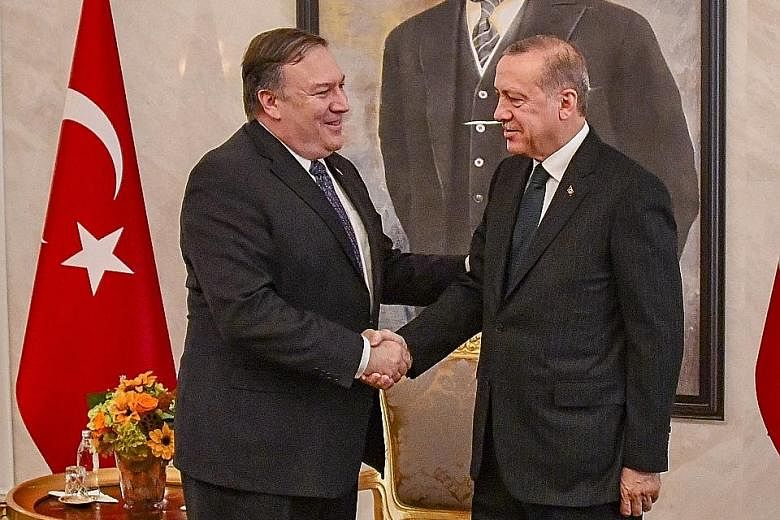 US Secretary of State Mike Pompeo (far left) with Turkish President Recep Tayyip Erdogan at their meeting in Ankara yesterday. The top diplomat arrived in Ankara after Riyadh, where he met King Salman and later, his son Prince Mohammed.