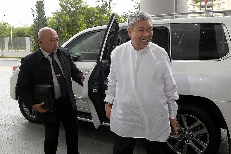 Datuk Seri Ahmad Zahid Hamidi arriving at MACC's headquarters in Putrajaya last Friday to give his statement regarding a probe into misappropriation of funds belonging to his family-owned welfare foundation.