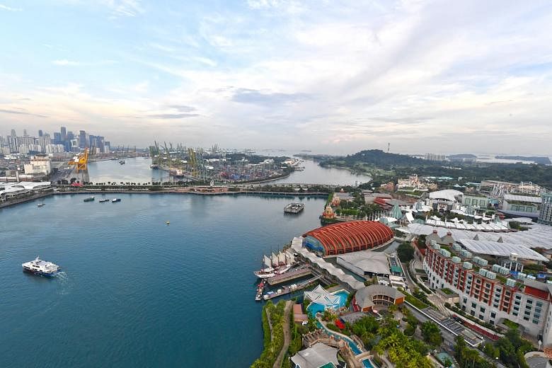 Sentosa (right) is set to get a boost with more attractions and investments, and government agencies are also drawing up development plans for the adjacent Pulau Brani (background). The whole area will be branded as the Southern Gateway of Asia.