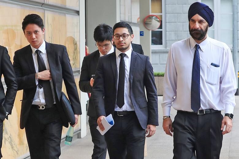 Senior Counsel Davinder Singh (right) and his legal team. He said Mr Low Thia Khiang had "directed" FMSS to bring Hougang Town Council's staff under its control even before it was officially appointed.