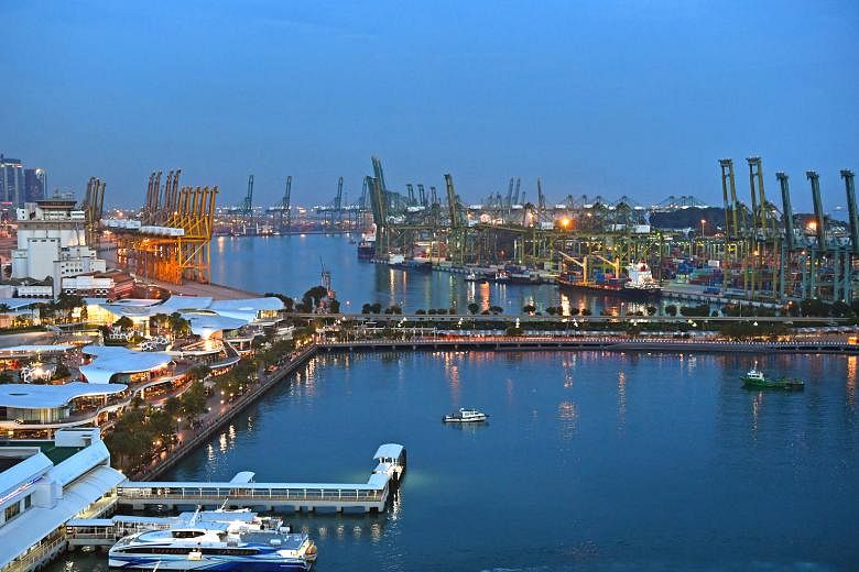 VivoCity (left) on mainland Singapore with the bridge leading to Sentosa, and Pulau Brani in the background. The relocation of port terminals to Tuas will free up some 1,000ha of land for a new waterfront city.