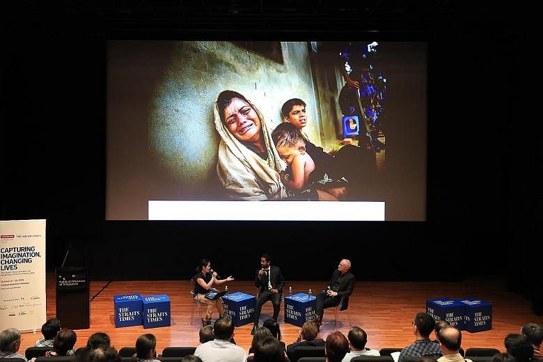 From left: Straits Times executive photojournalist Neo Xiaobin with Mr Masfiqur Sohan and Mr Patrick Brown at a panel discussion on conflict and refugee crises, at the National Museum of Singapore yesterday.