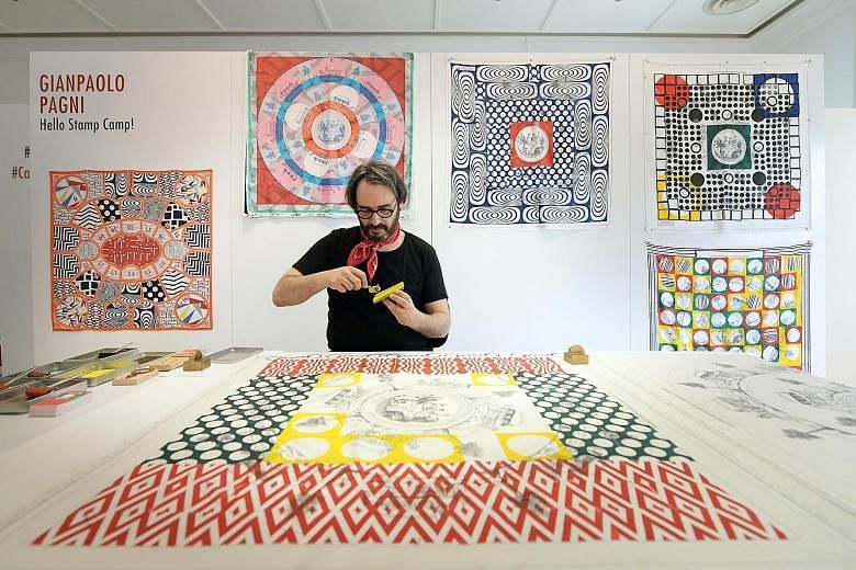 Watch French artist Gianpaolo Pagni design scarves at the exhibition. Karaoke is among the Hermes Carre Club activities.