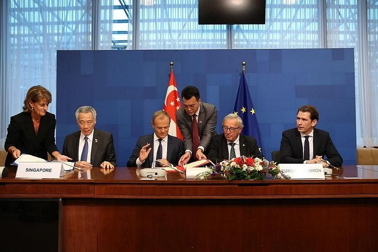 Prime Minister Lee Hsien Loong at the signing of the EU-Singapore FTA with (from left) European Council President Donald Tusk, European Commission President Jean-Claude Juncker and Austrian Chancellor Sebastian Kurz.