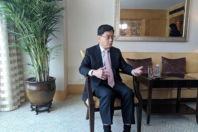 Finance Minister Heng Swee Keat said one way the world can do its part in finding a solution to the mounting US-China trade dispute is by studying how World Trade Organisation rules need to be changed to take into account the changing structure of th