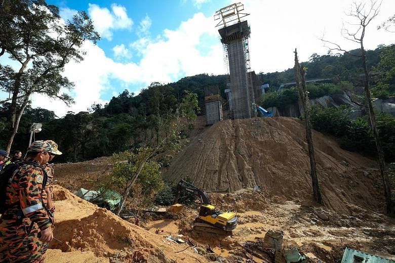 Search and rescue operations yesterday at a construction site hit by a landslide in Penang. It is believed that construction sites are not following the soil erosion mitigation plan stipulated in their project approvals.