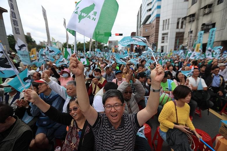 Pro-Taiwan independence activists calling for a referendum in Taipei yesterday. Organisers said that more than 100,000 people turned up for the mass protest.