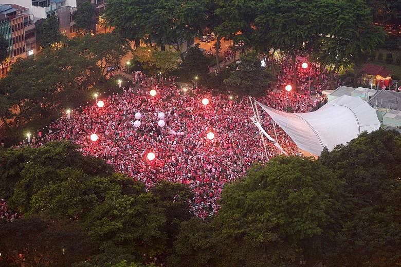 Participants with lighted torches at a Pink Dot event in Hong Lim Park. The writer says that perhaps more people support decriminalisation while fewer would agree on gay marriage. There might well be differences on this, even among the lesbian, bisex