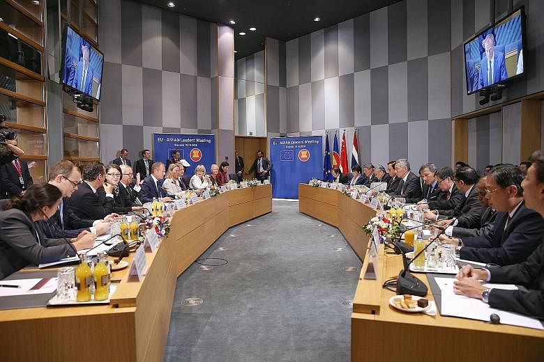 Prime Minister Lee Hsien Loong notes that the old system of multilateralism is showing its strains and limitations. Prime Minister Lee Hsien Loong with other leaders at last Friday's Asia-Europe Meeting Summit in Brussels. The summit involving 30 Eur